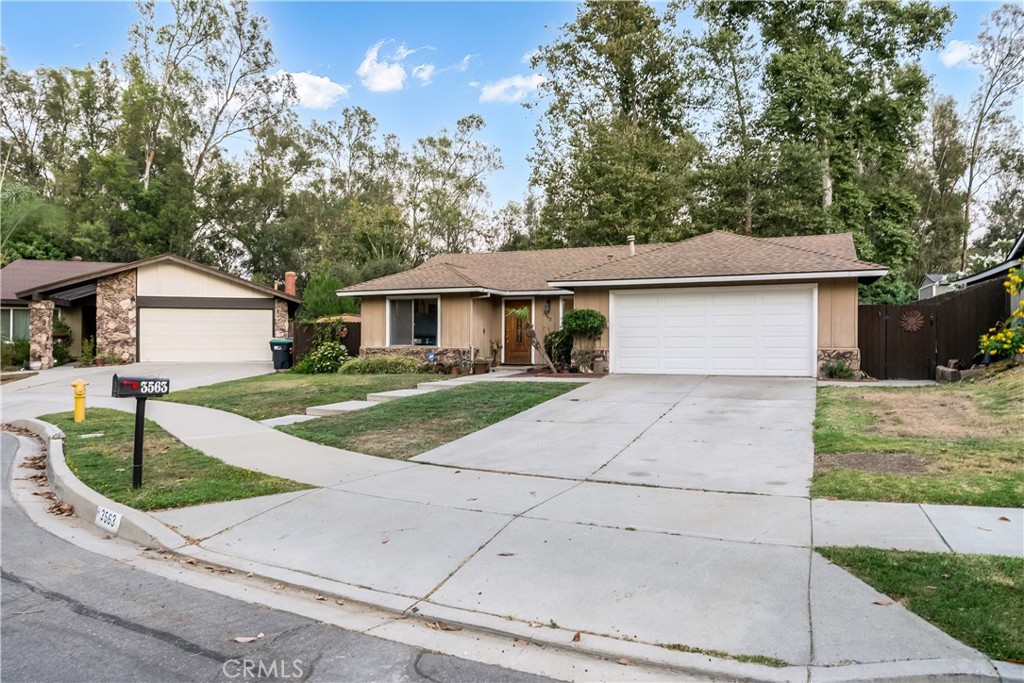 a front view of a house with yard