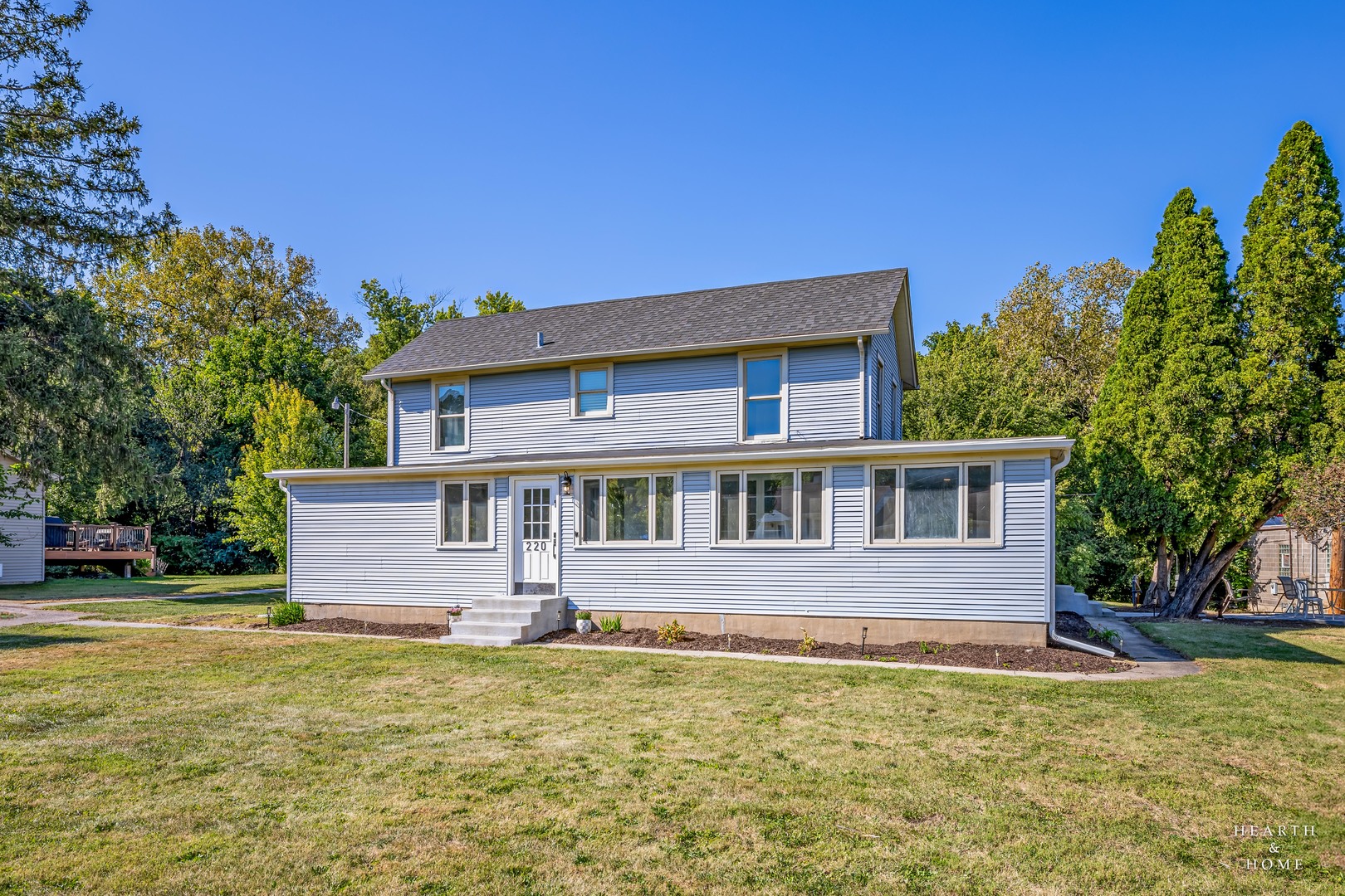 a front view of a house with a yard