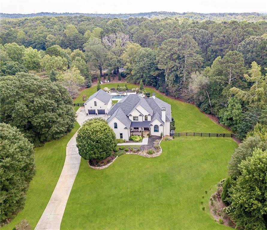 an aerial view of a house with a garden