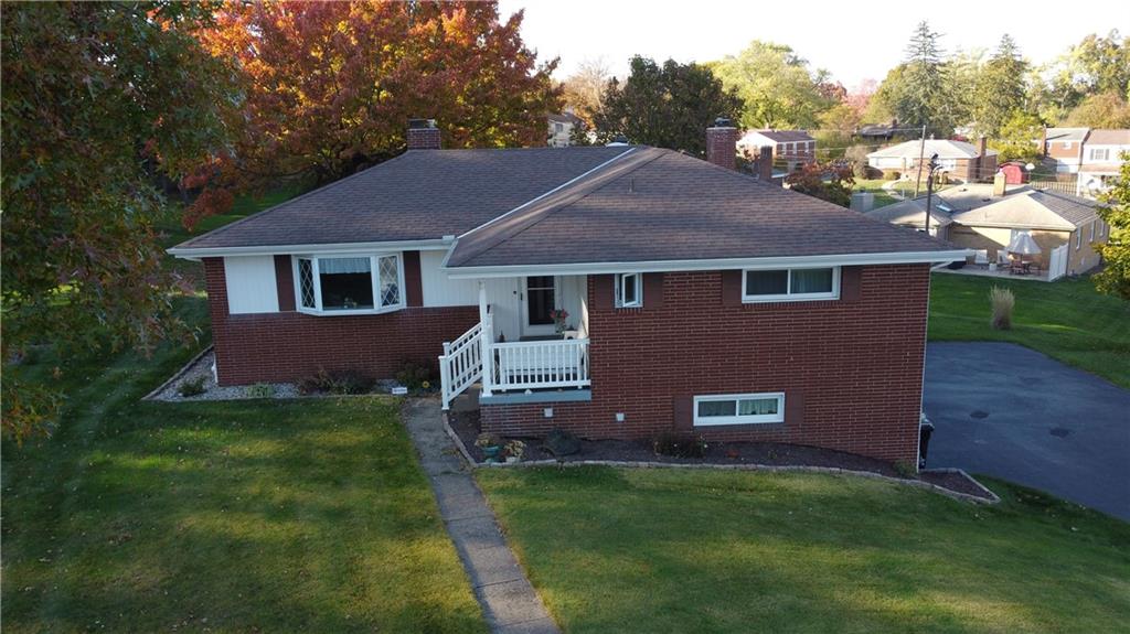 a aerial view of a house with a yard