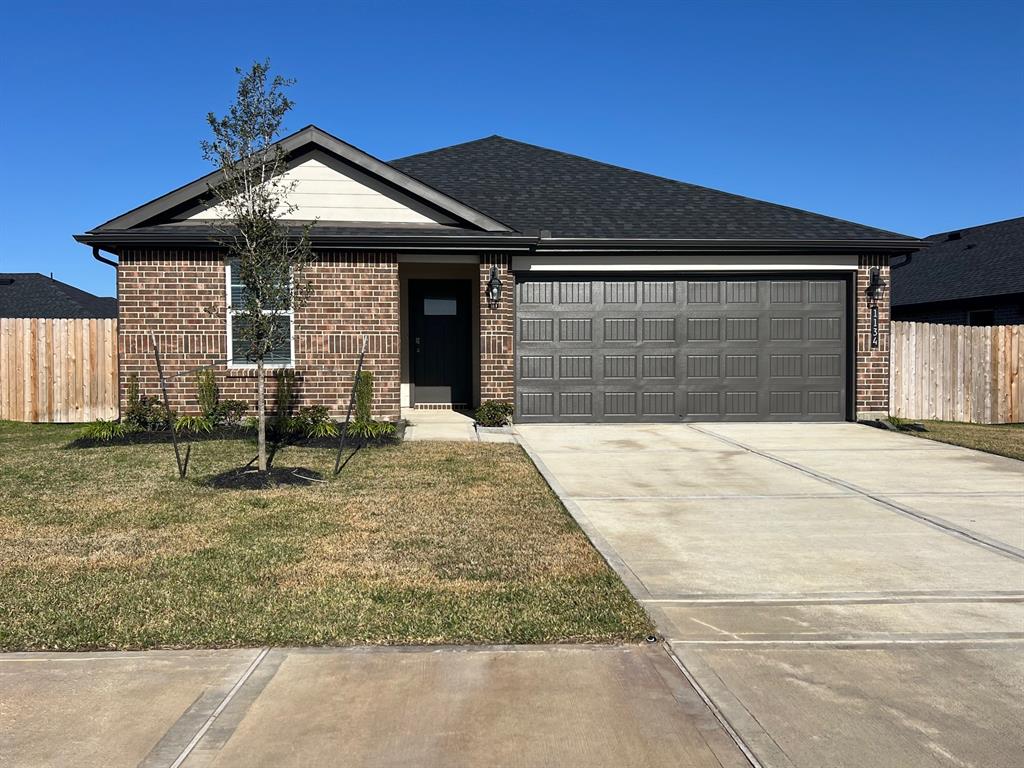 a front view of a house with garage