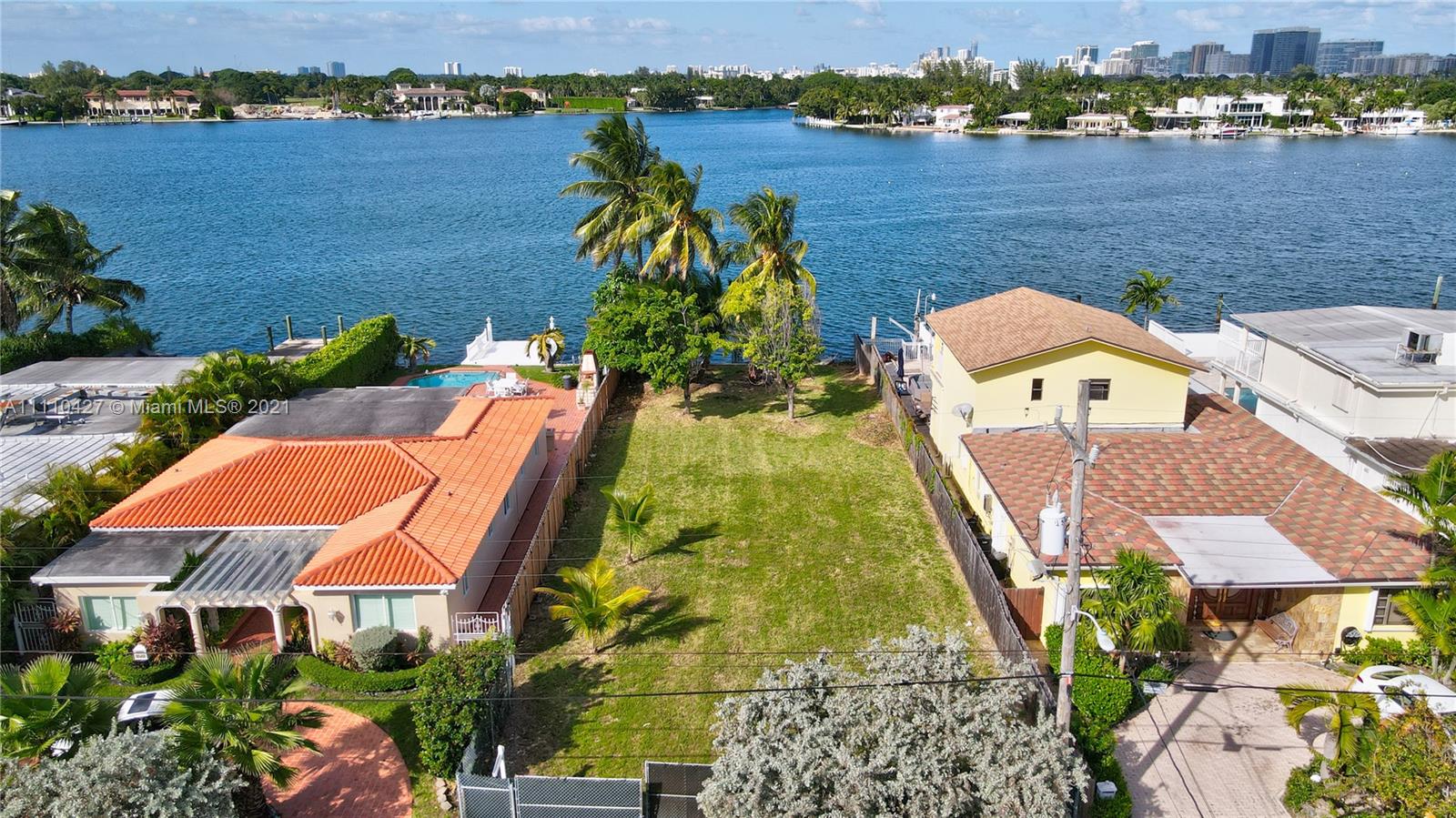 an aerial view of a house with a lake view