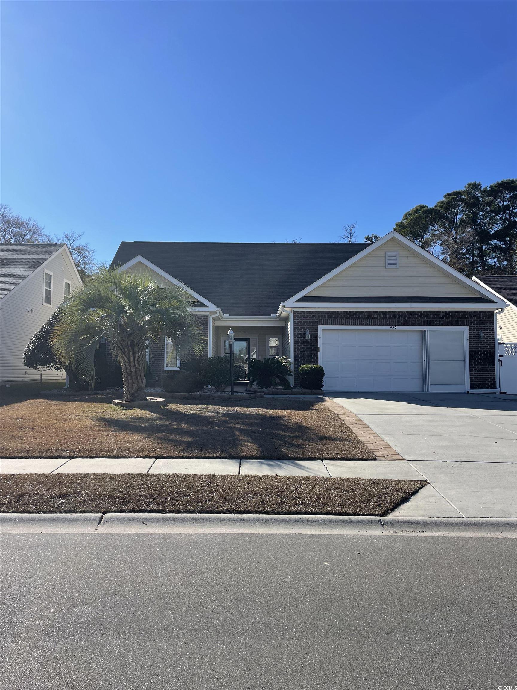 Ranch-style house featuring a garage