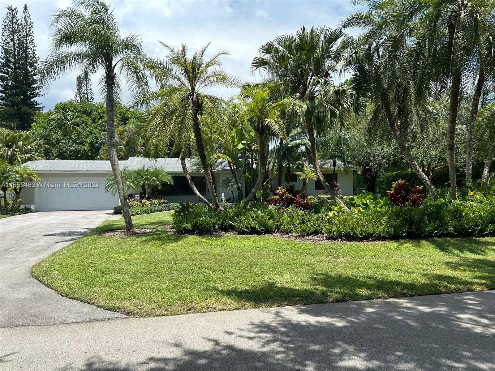 a view of a backyard with a fountain