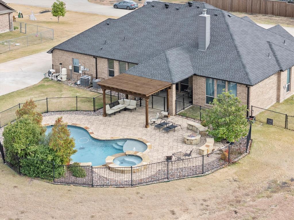 an aerial view of a house with entertaining space