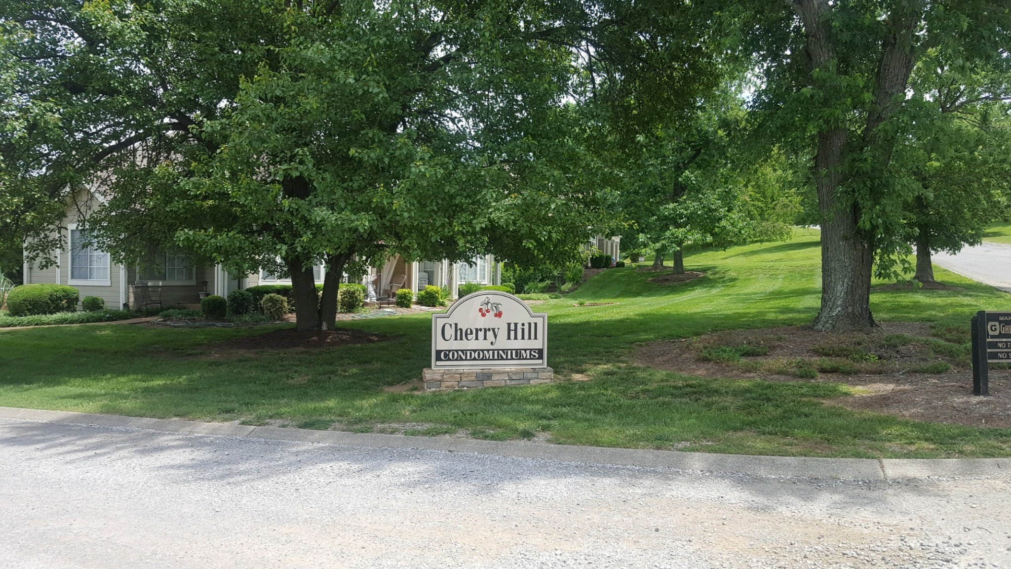 a sign board with garden area