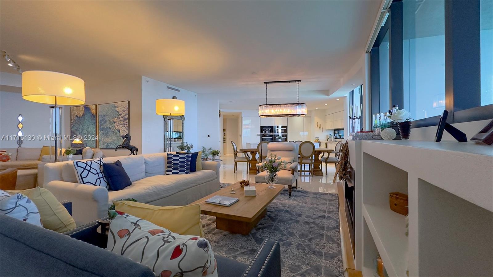 a living room with furniture and a large mirror