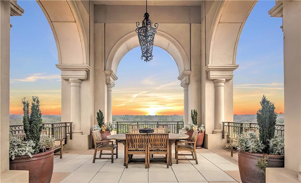 a view of balcony with furniture