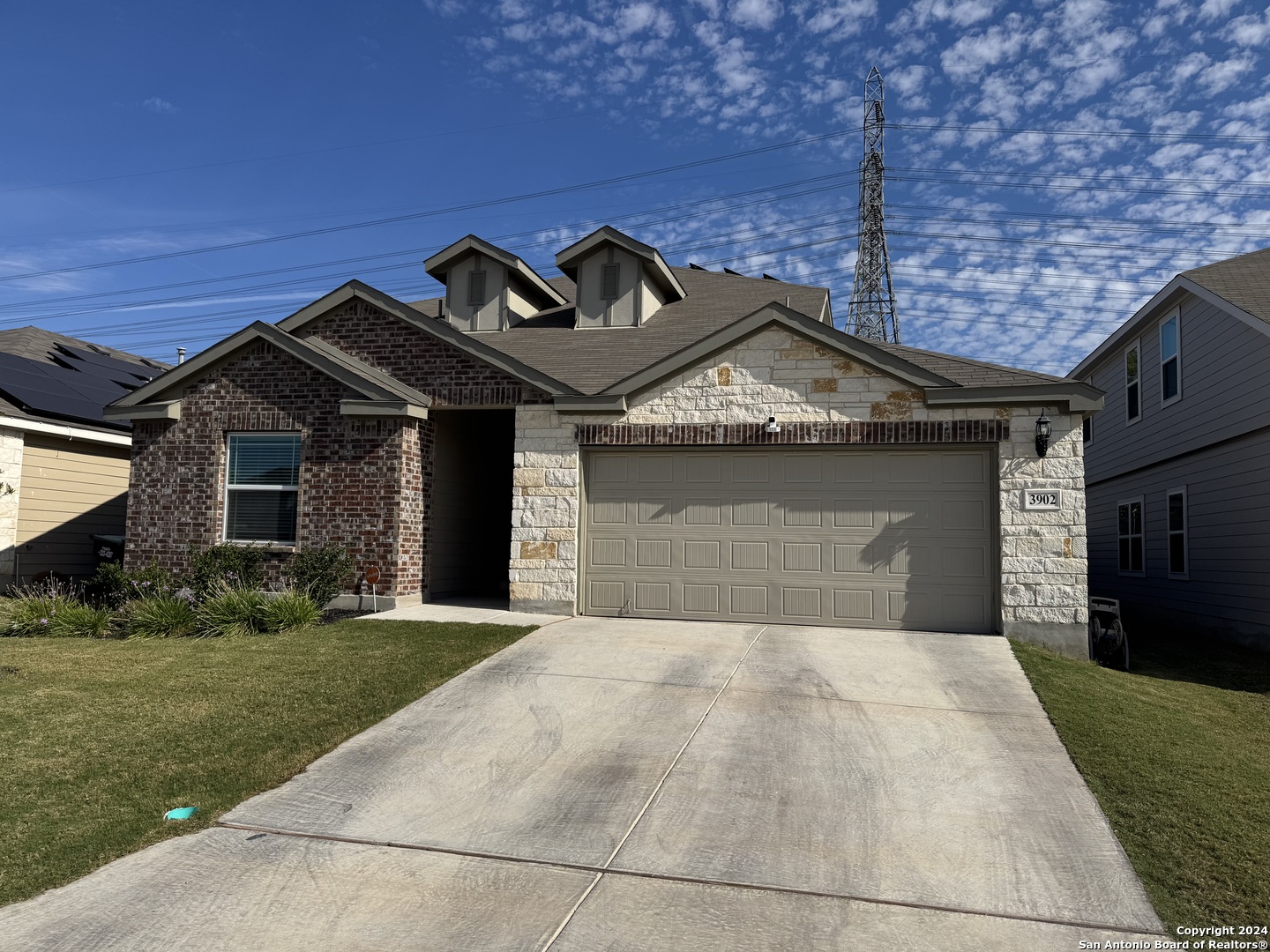 a front view of a house with yard