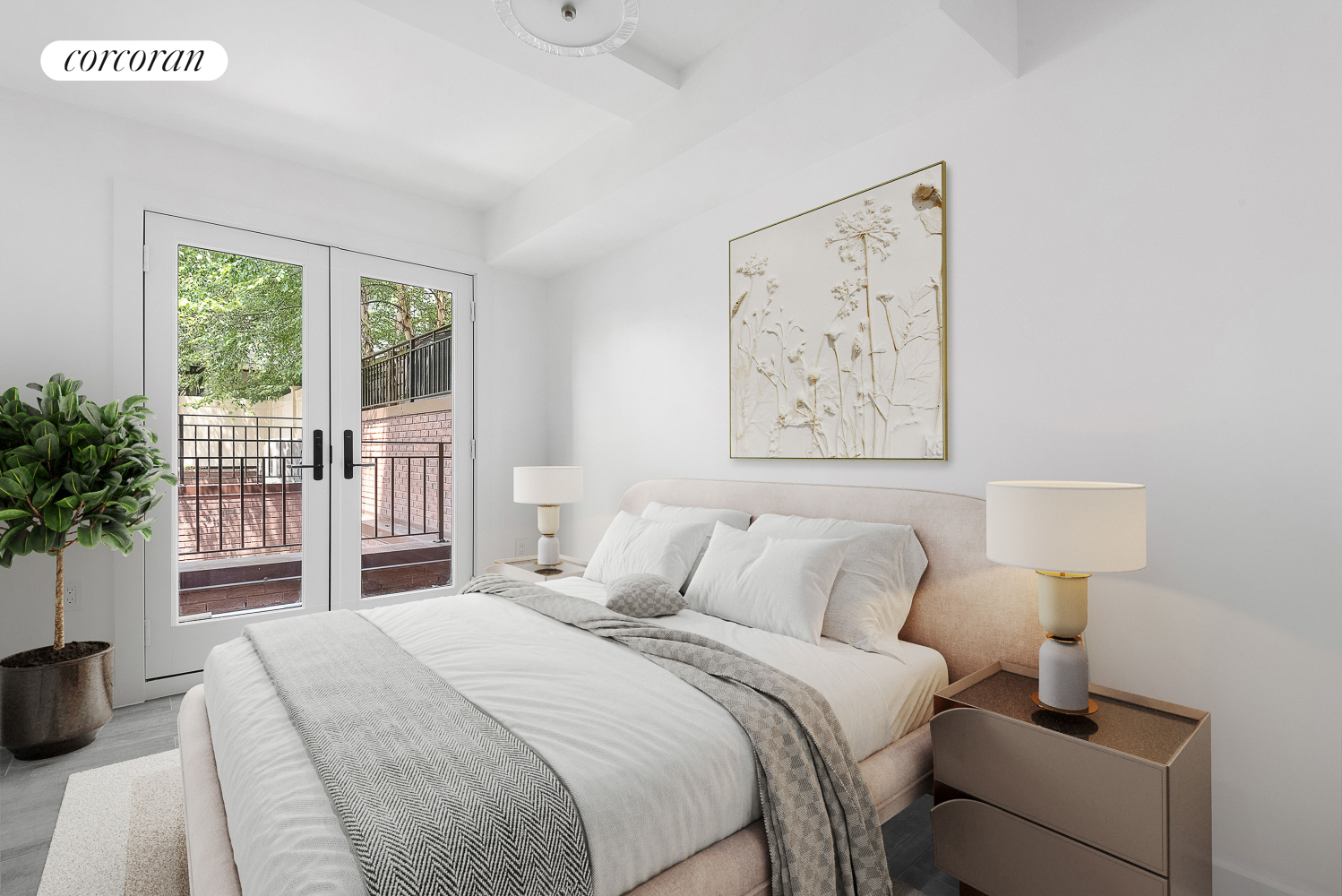 a bedroom with a large bed and a potted plant