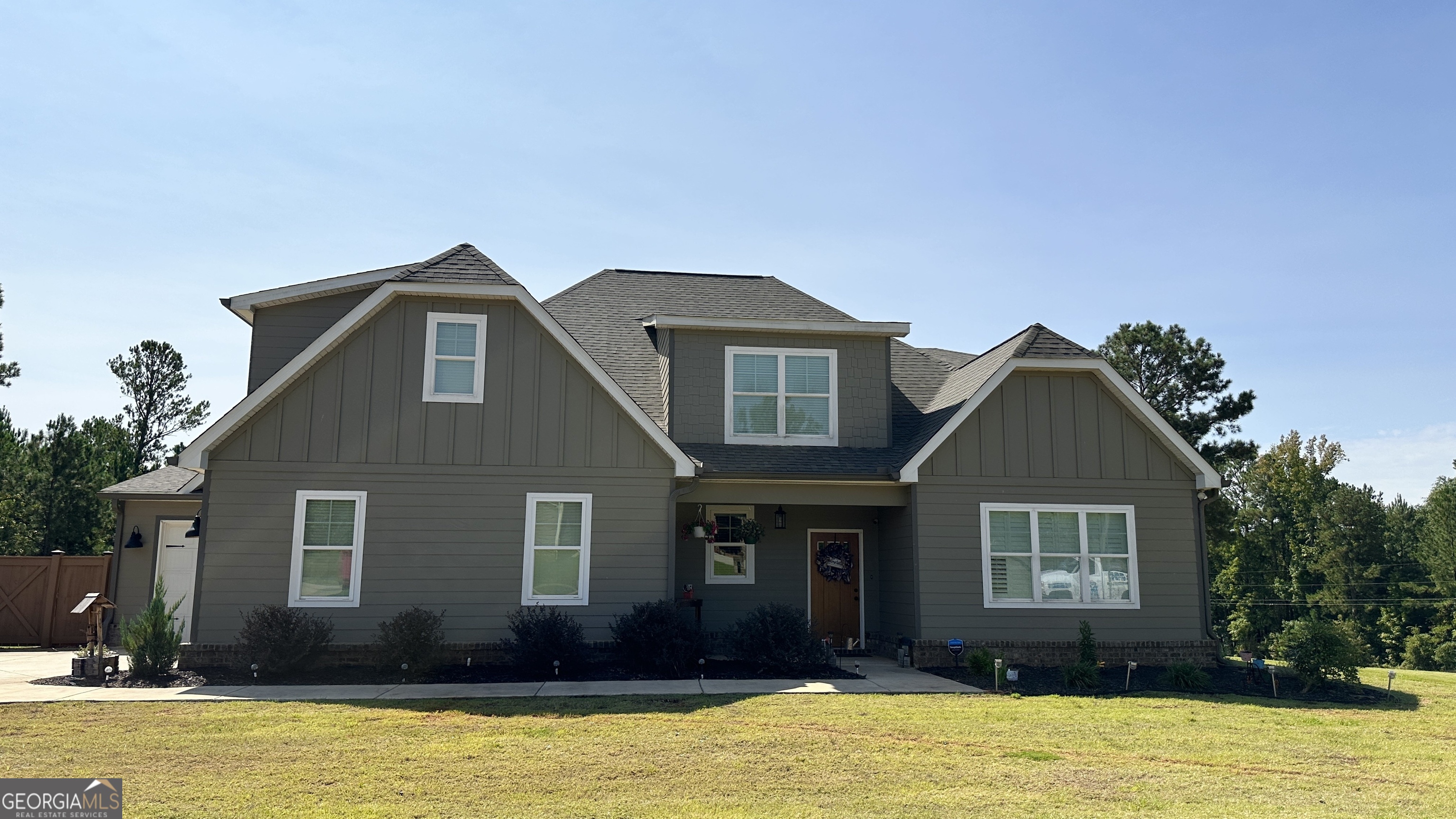 a front view of a house with a yard