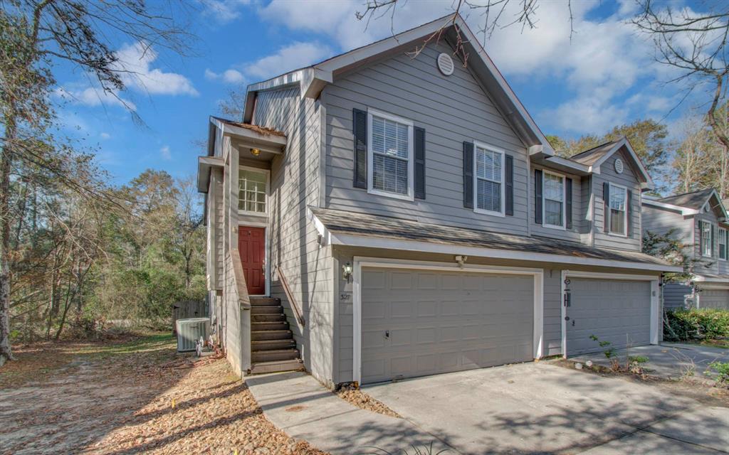 a front view of a house with a garage