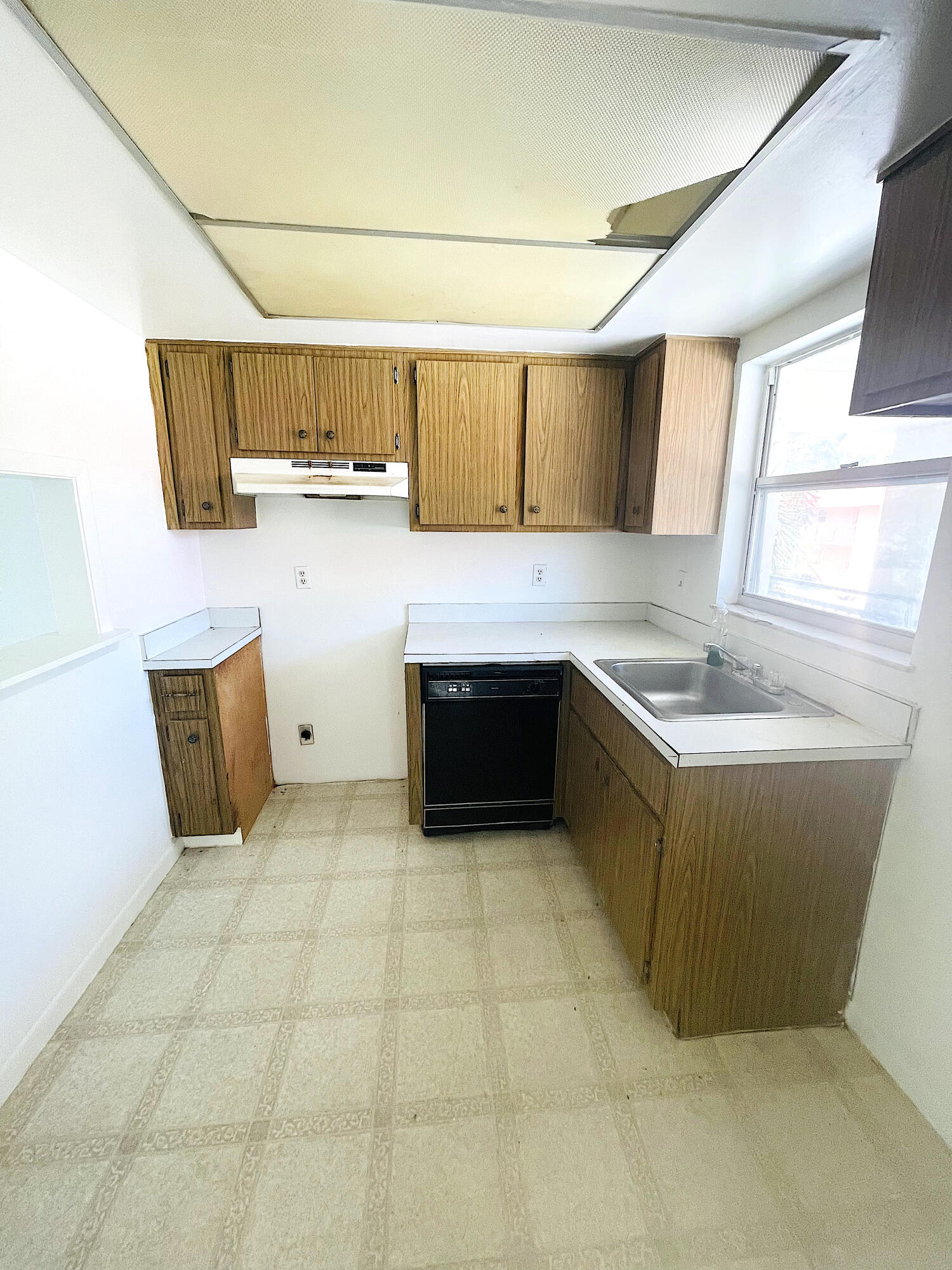 a kitchen with stainless steel appliances a sink and a cabinets