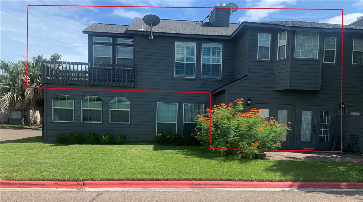 a front view of a house with a garden and plants