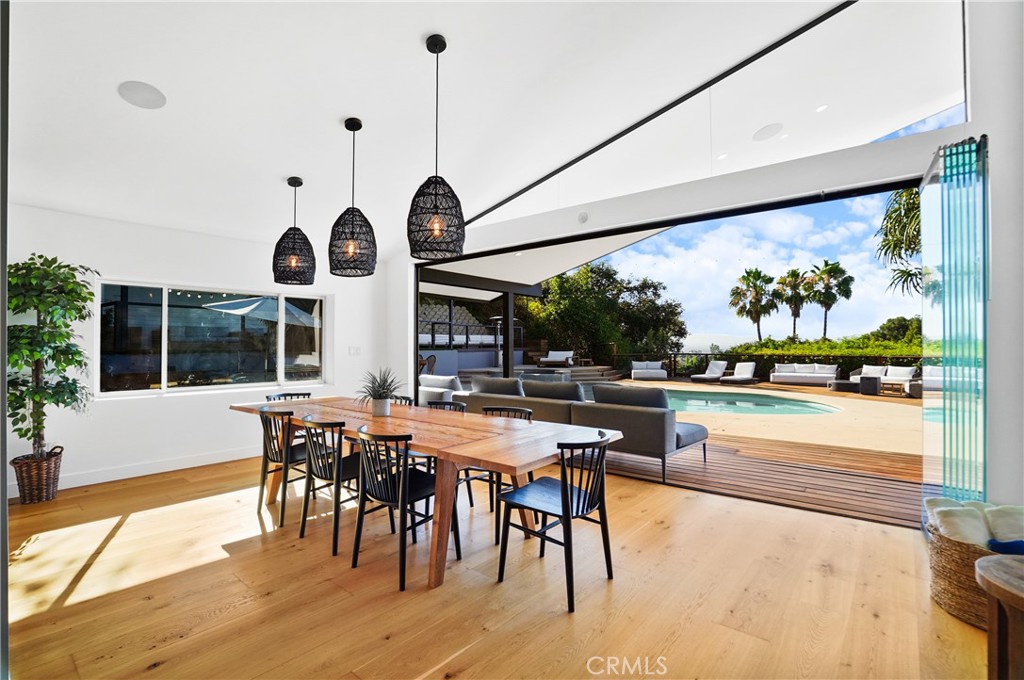 a very nice looking dining room with a large window