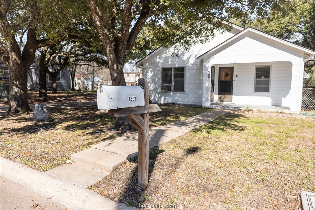 a front view of a house with yard