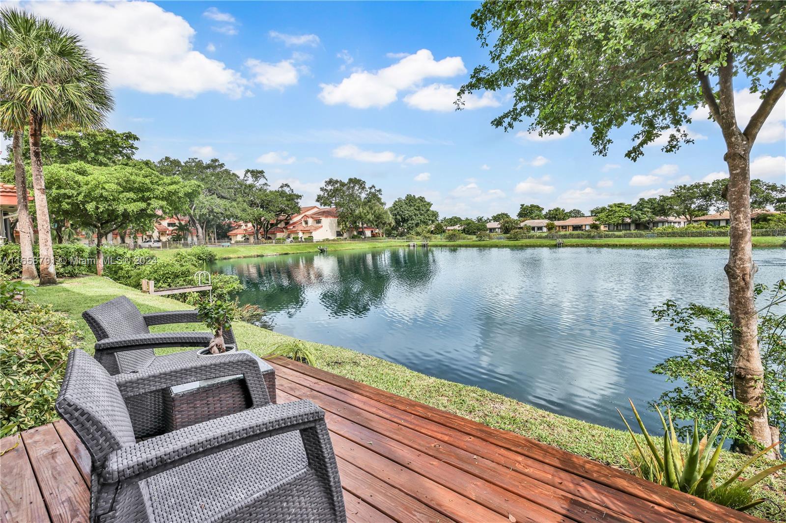 a view of a lake with outdoor seating