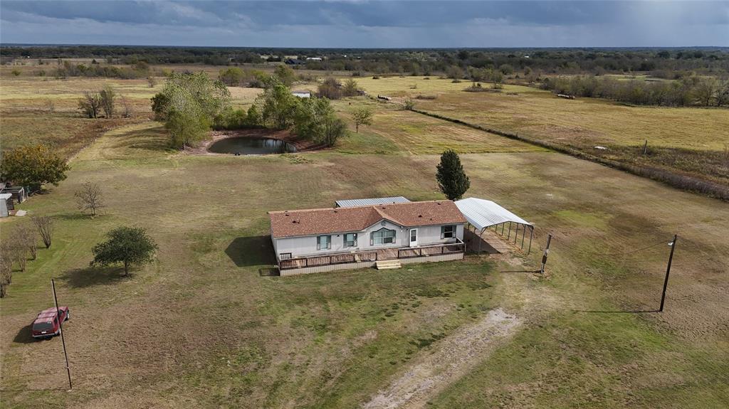 a aerial view of a house with a yard