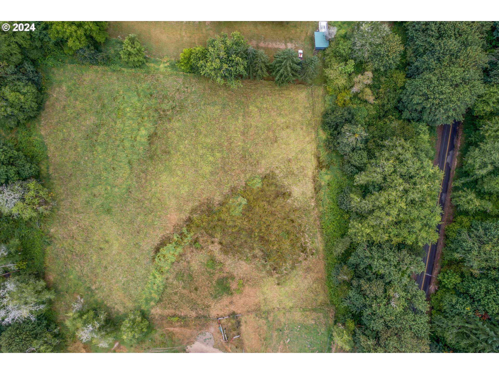 a view of a lake with a yard