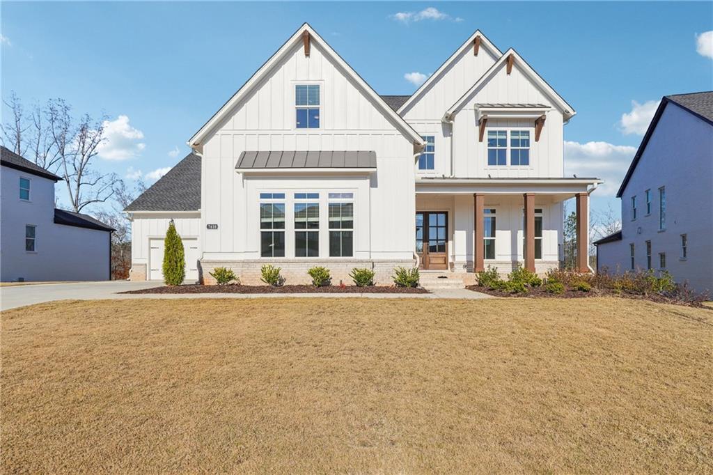 front view of a house with a yard