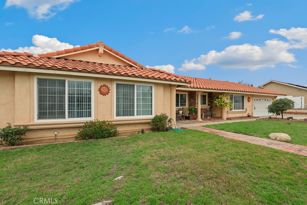 front view of a house with a yard