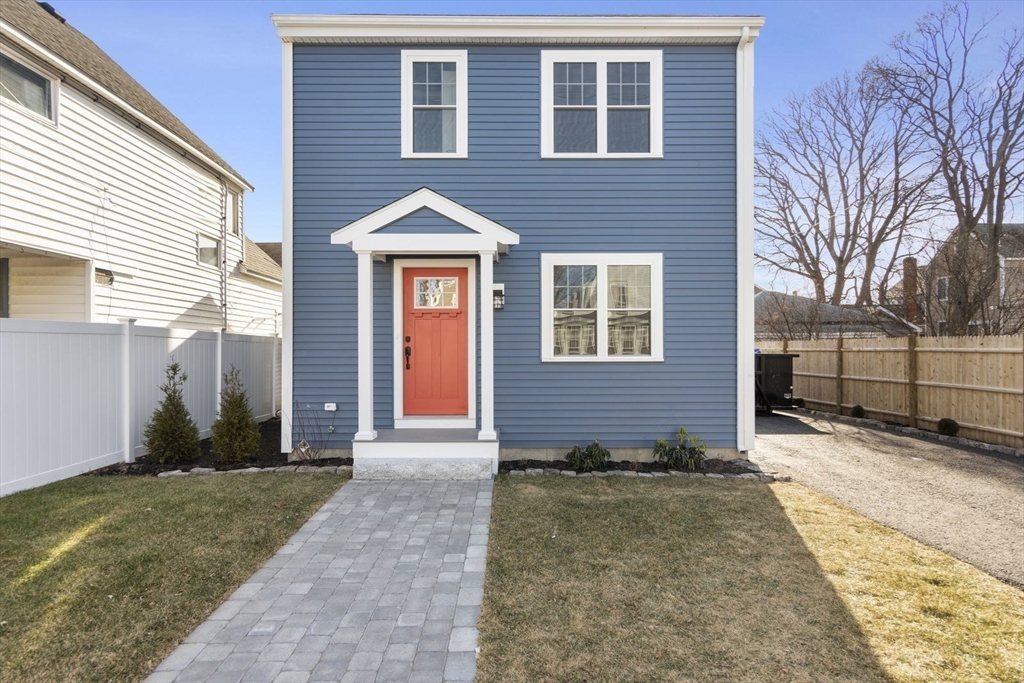 a view of a brick house with a yard