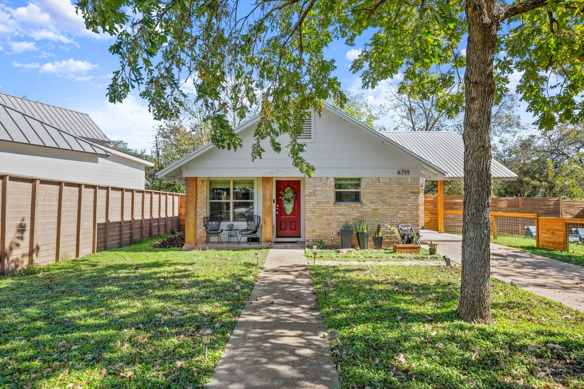 a house view with a sitting space and garden view