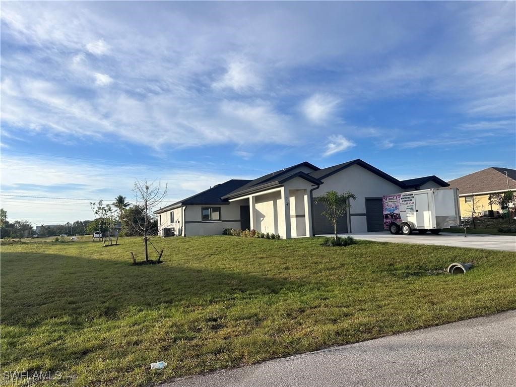 a front view of a house with a yard