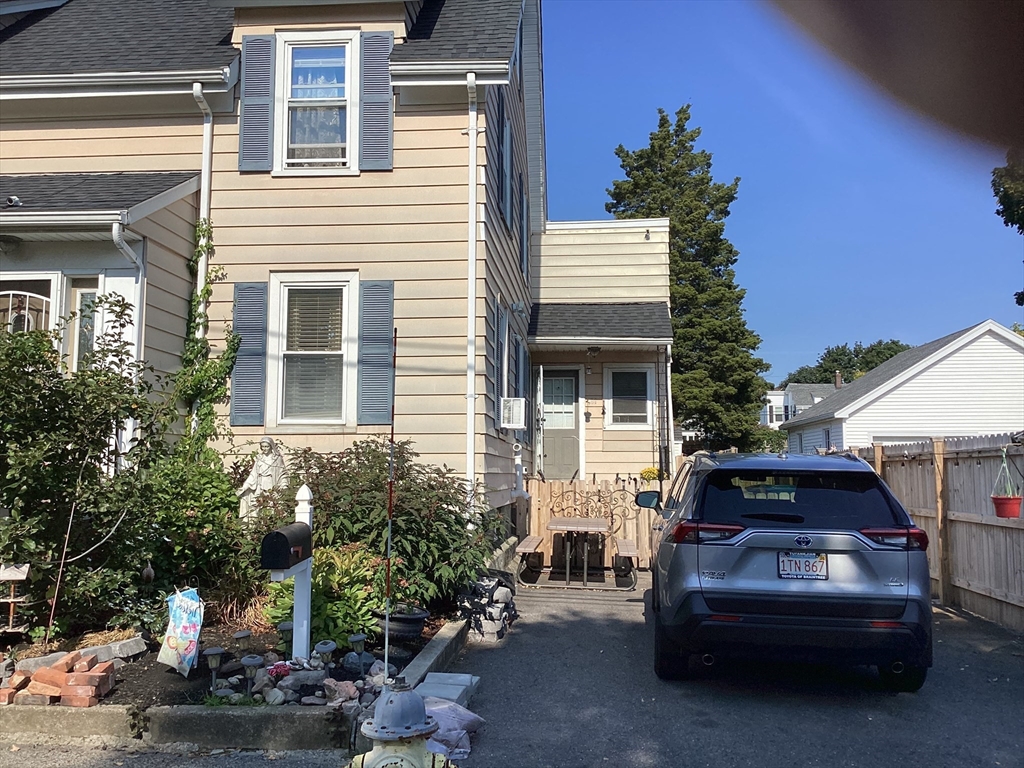 a view of a car park in front of house