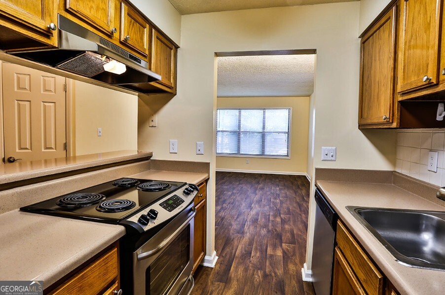 a kitchen with a stove and a microwave