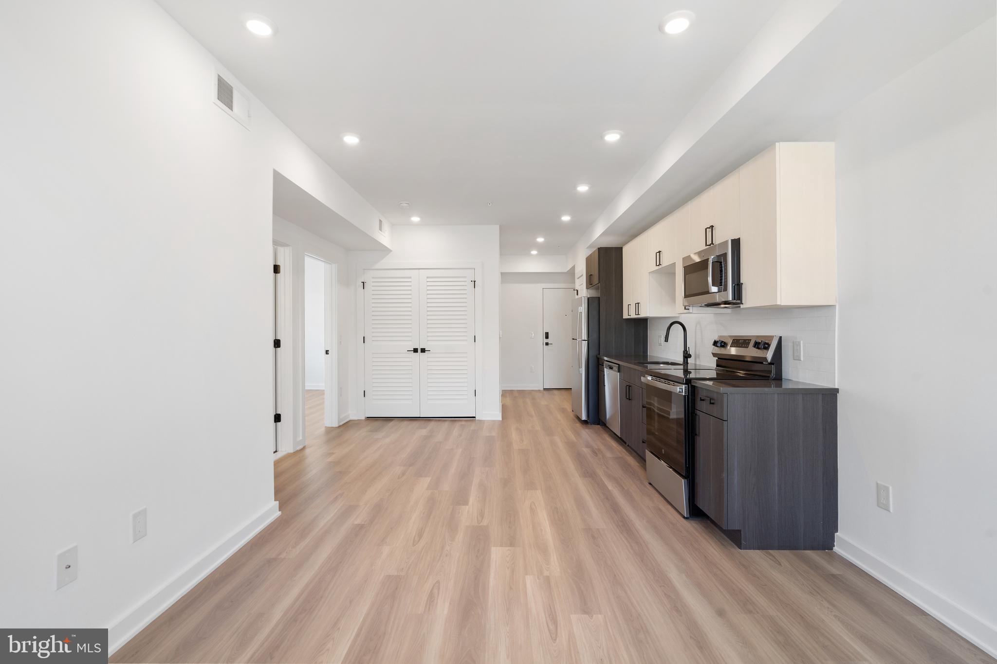 a view of kitchen with wooden floor