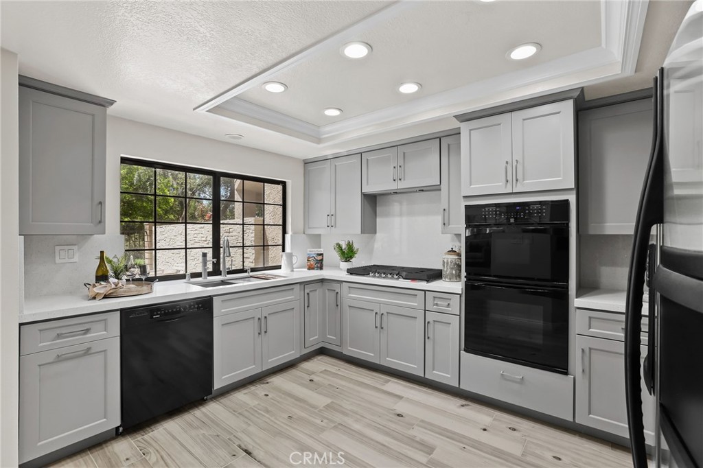 a kitchen with a sink stove and refrigerator