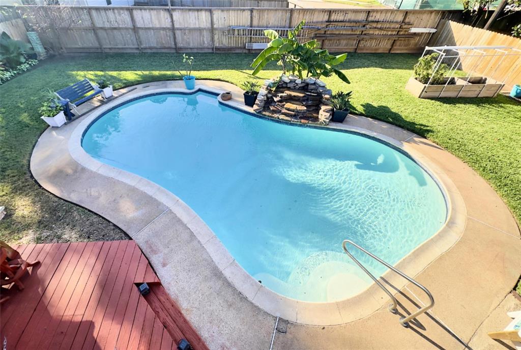 Super fun backyard features well maintained pool with rock waterfall, garden, shed w/electricity, covered patio, and both open and covered deck space.