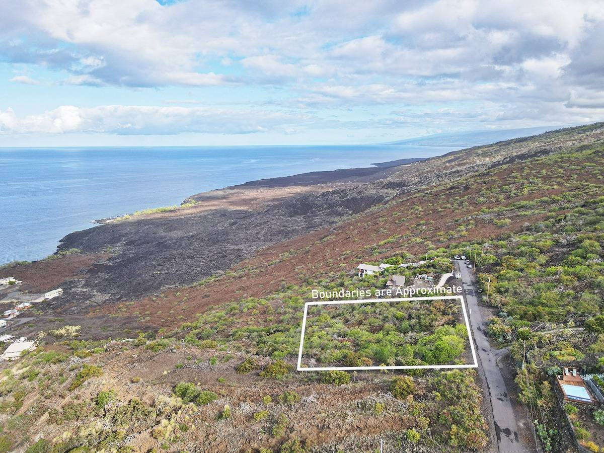 a view of a yard with an ocean