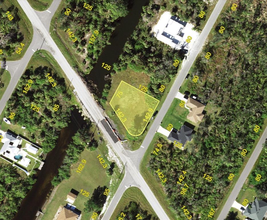 an aerial view of a residential houses with outdoor space