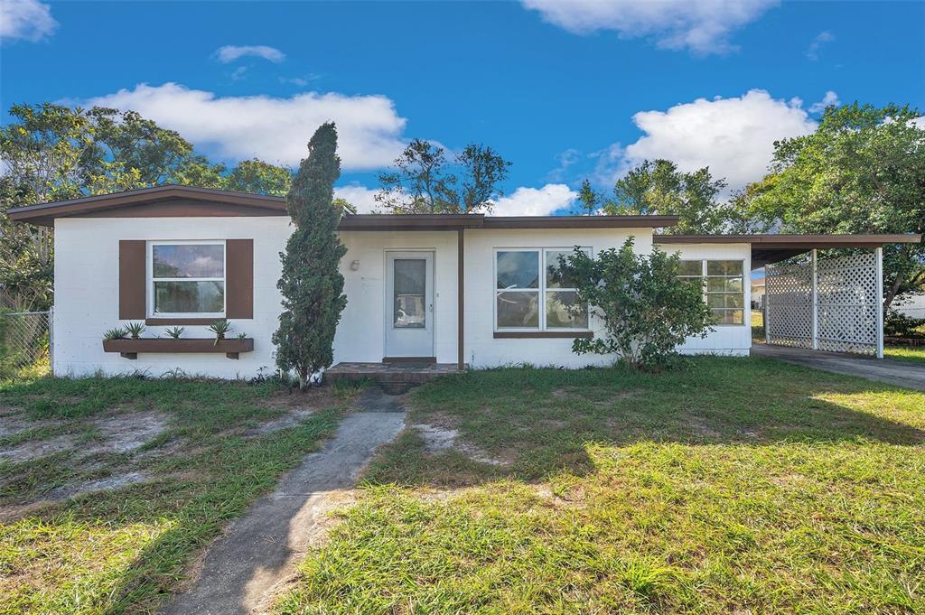 front view of a house with a yard