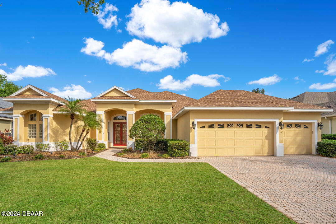 a front view of a house with a yard