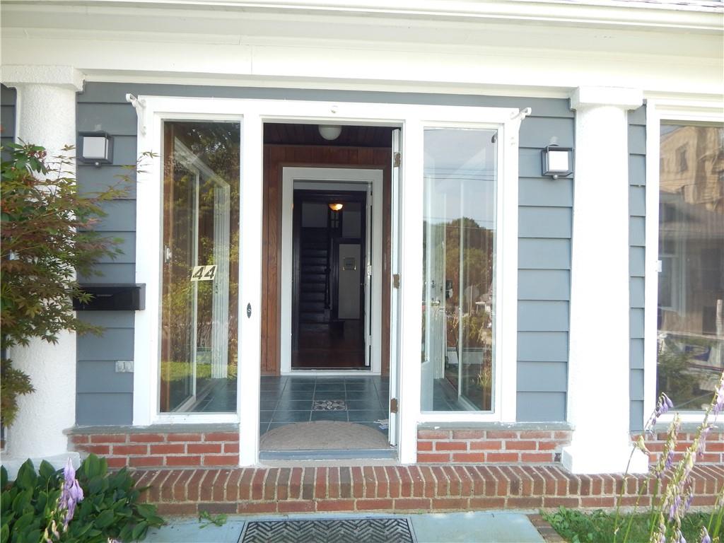 a view of a door of a house with a small yard