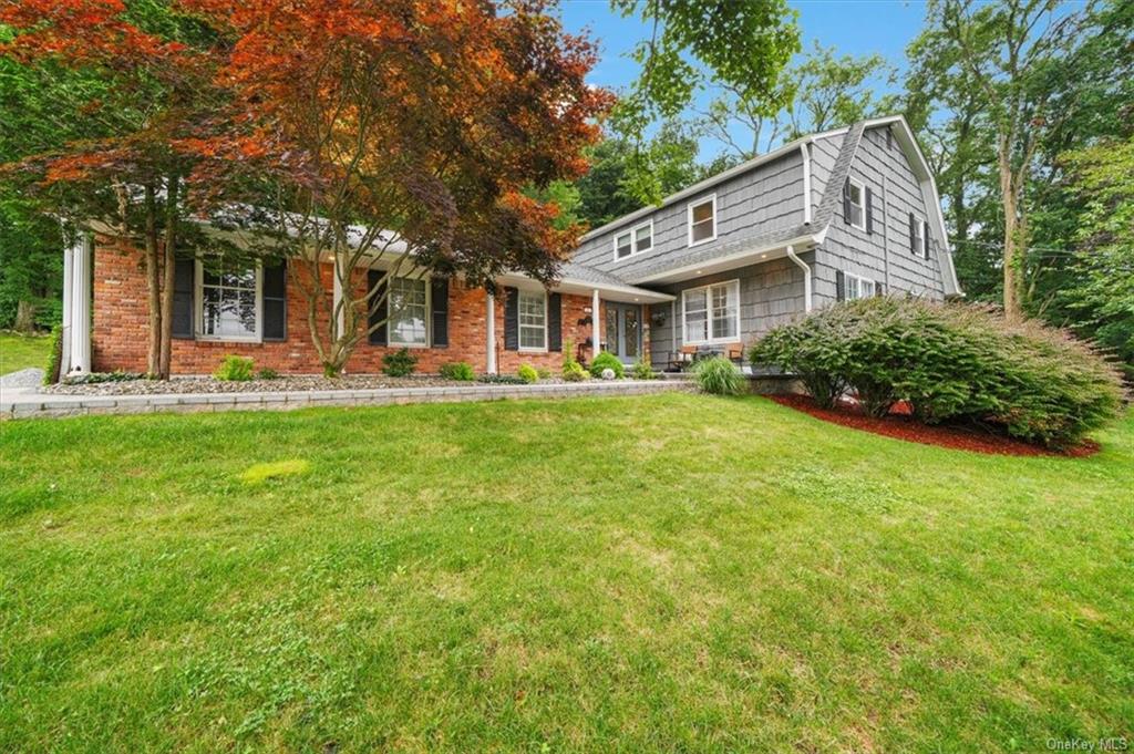 View of front of home featuring a front lawn