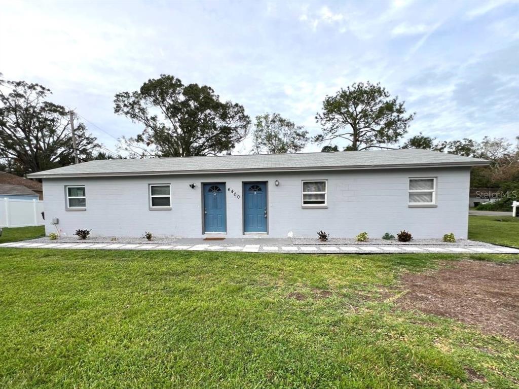 front view of a house with a yard