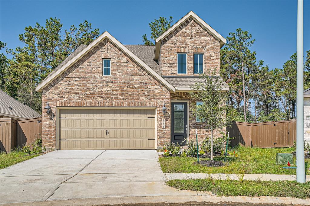 Beautiful brand-new 4-bedroom, 3.5-bathroom home with a charming brick exterior and a spacious two-car garage. Surrounded by a scenic wooded area, this home offers modern finishes, an inviting front yard, and a prime location for privacy and relaxation.