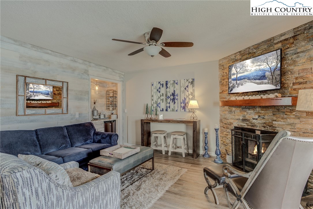 a living room with furniture and a fireplace