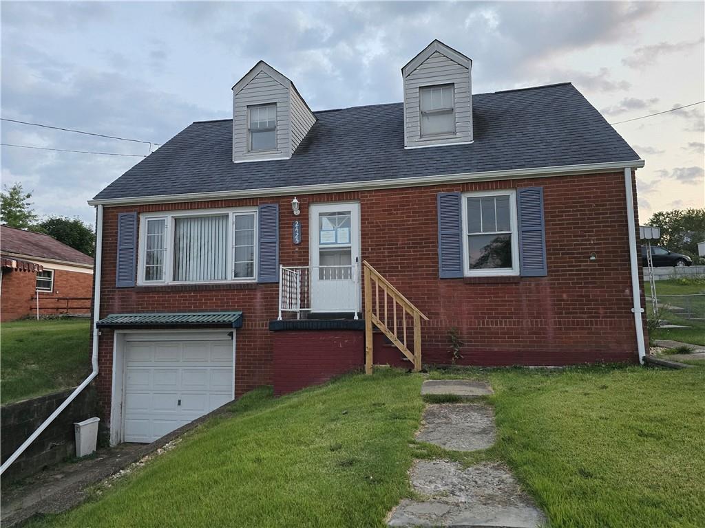 front view of a house with a yard