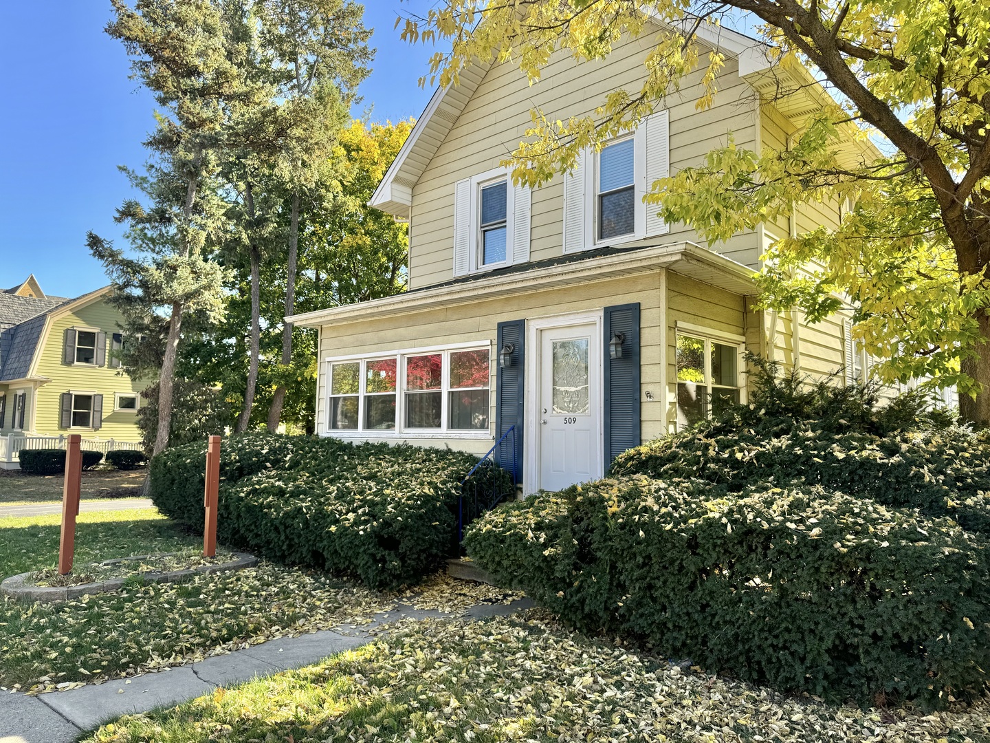 a view of a brick house with a yard