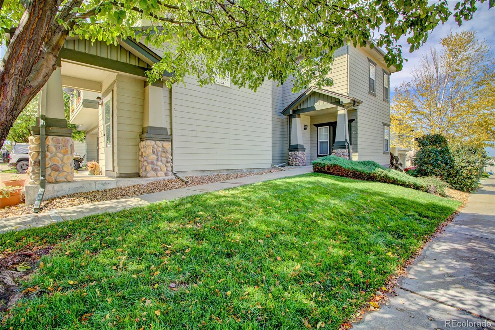 a front view of a house with a yard and pathway