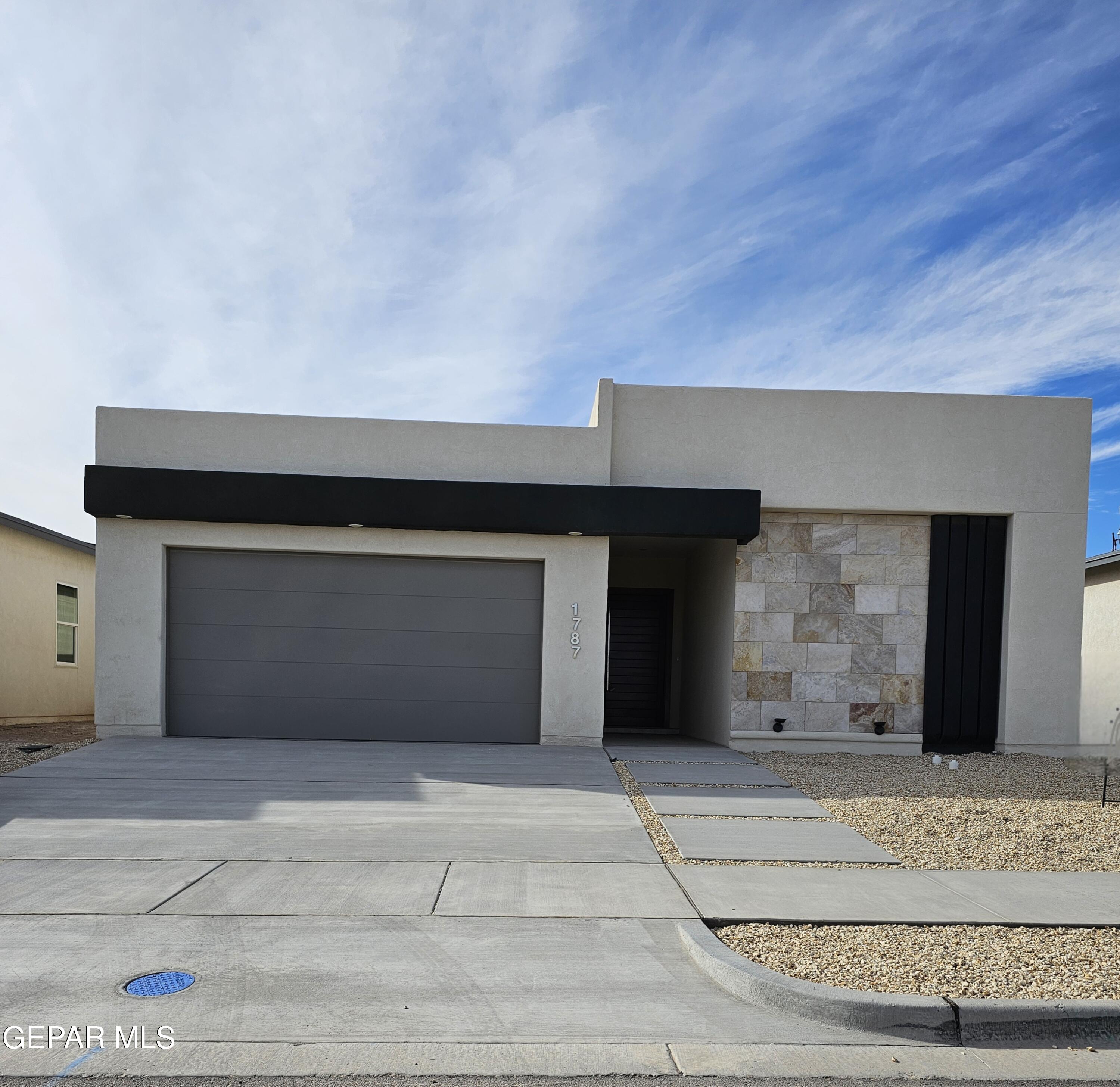 a view of a house with a garage