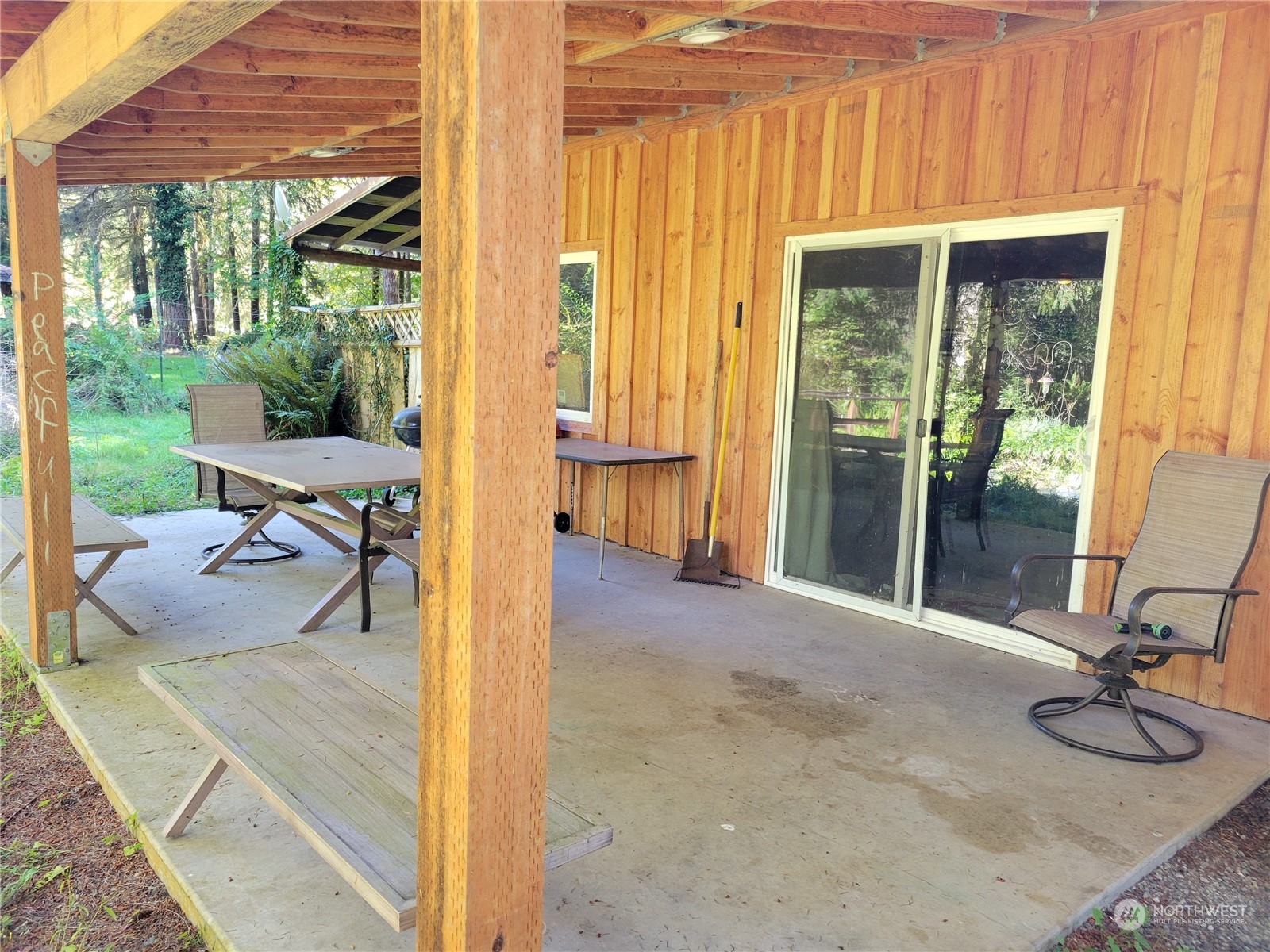 a view of a patio with chair and tables