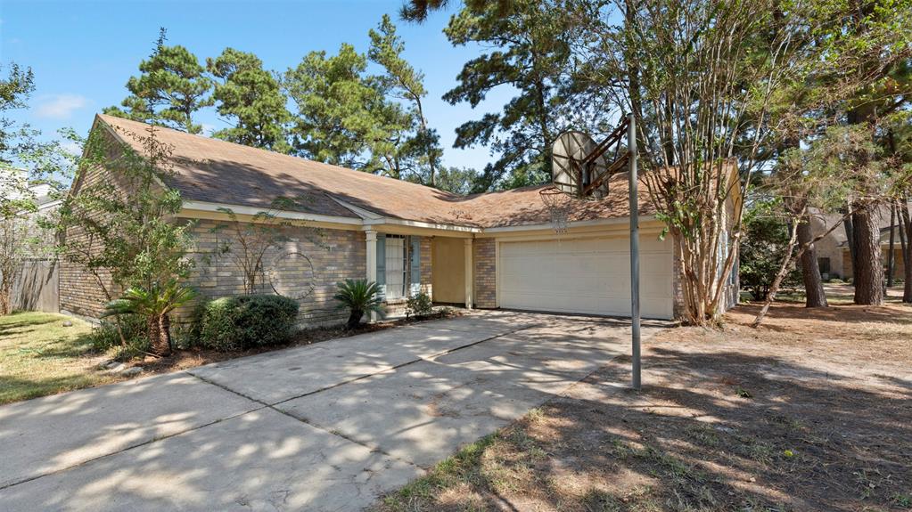 a view of a house with a yard and garage