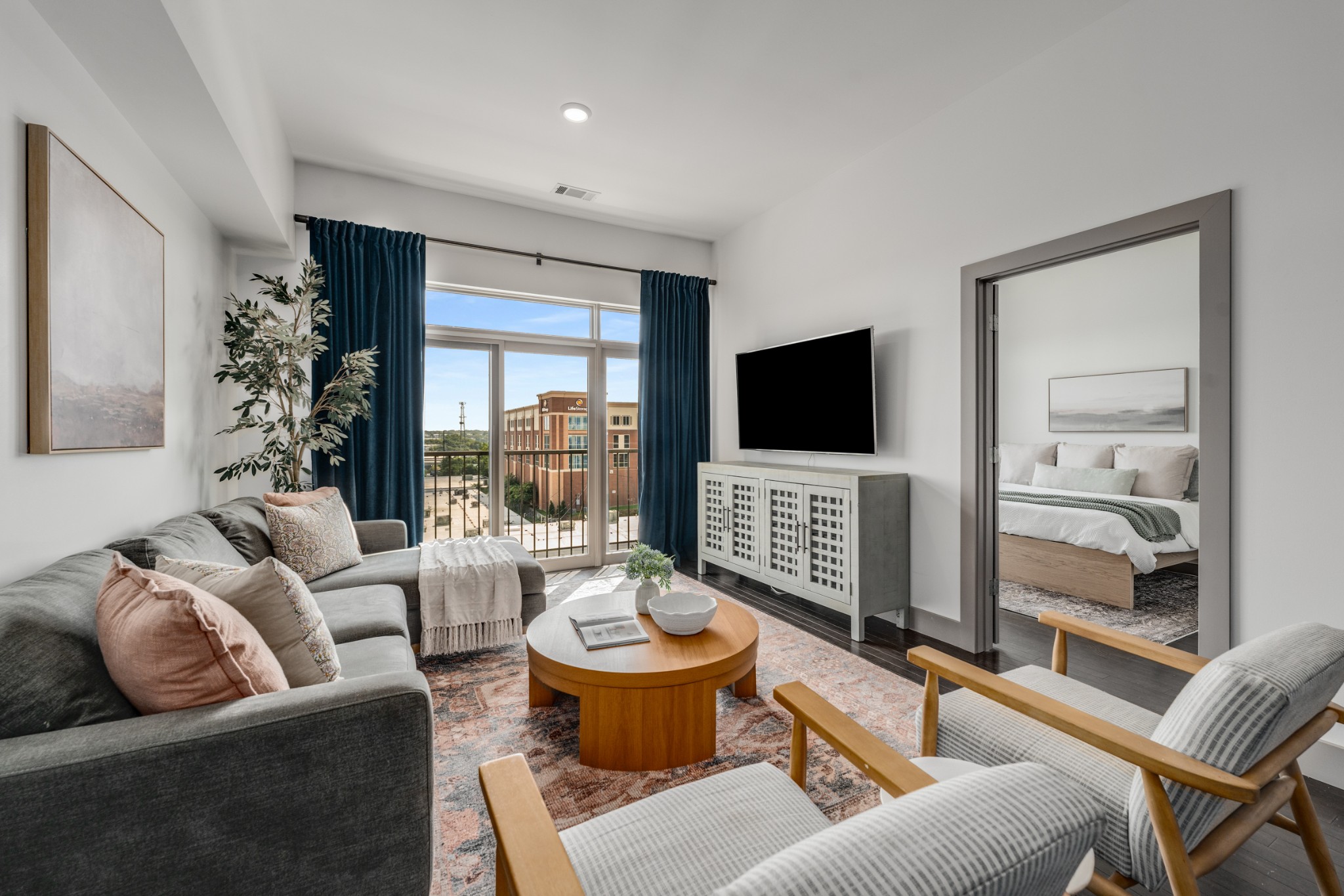 a living room with furniture and a flat screen tv