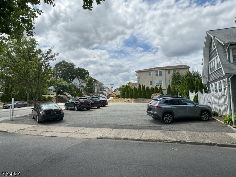 a view of street with parked cars